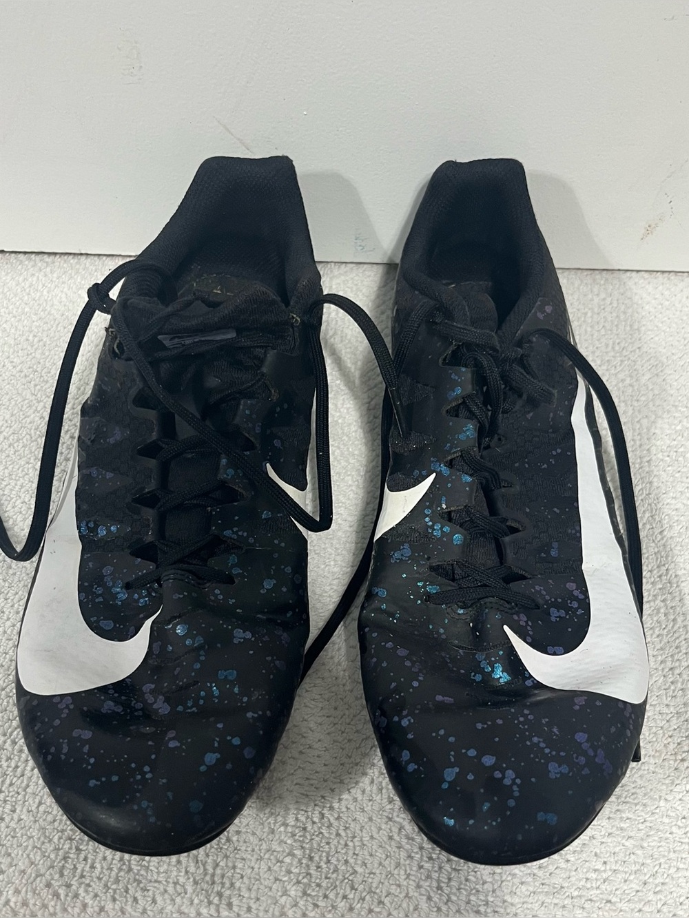 Nike Black Cleats with White Swoosh and Blue Speckle Size 11